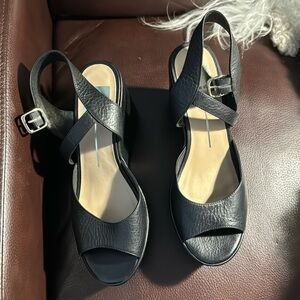 New in the box-black sandal about 3.5” heel.